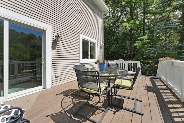 2127 E Timberlane Dr, Traverse City, MI 49686 - wooden deck featuring outdoor dining space