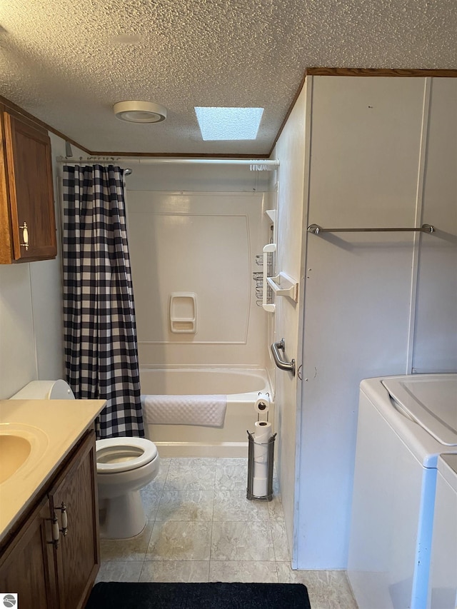 bathroom featuring washing machine and clothes dryer, toilet, a textured ceiling, vanity, and shower / bath combination with curtain