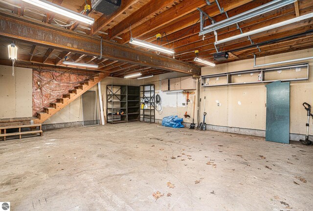 4676 W Mcmillan Rd, Muskegon, MI 49445 - garage featuring a garage door opener