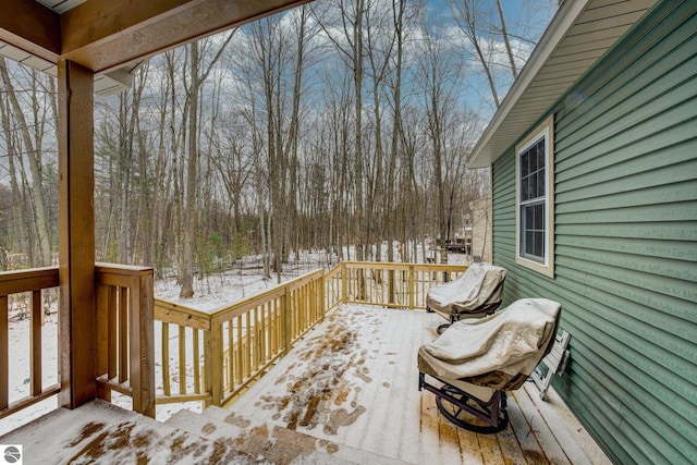 view of snow covered deck