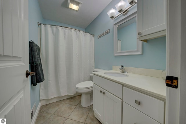 full bath featuring toilet, tile patterned floors, curtained shower, and vanity