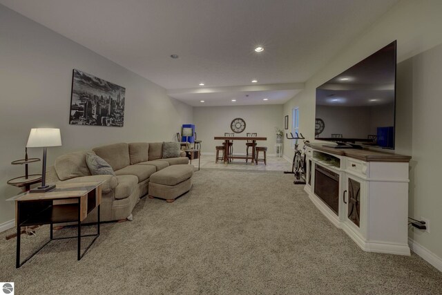 living room featuring baseboards, recessed lighting, and carpet flooring