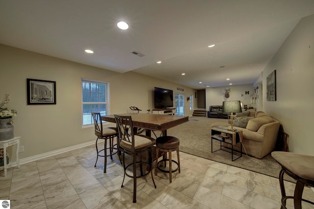 dining space featuring baseboards, visible vents, and recessed lighting