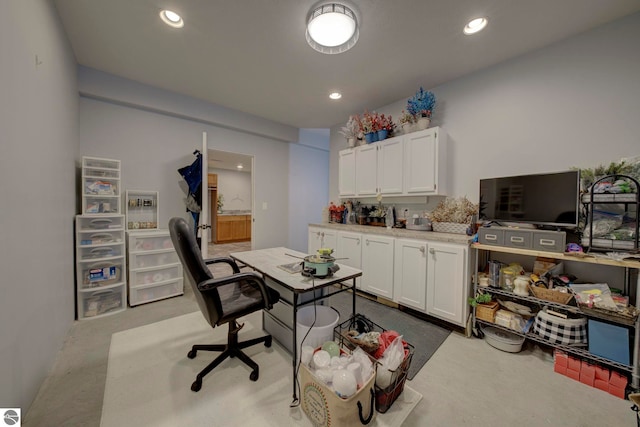carpeted office with recessed lighting