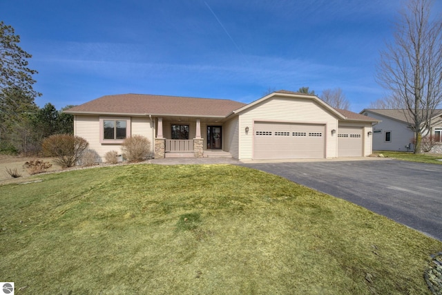 1339 Killdeer Ln, Kingsley, MI 49649 - single story home featuring aphalt driveway, a garage, a porch, a front yard, and a shingled roof