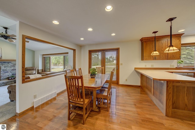 1339 Killdeer Ln, Kingsley, MI 49649 - dining area featuring light wood-style floors, plenty of natural light, visible vents, and baseboards