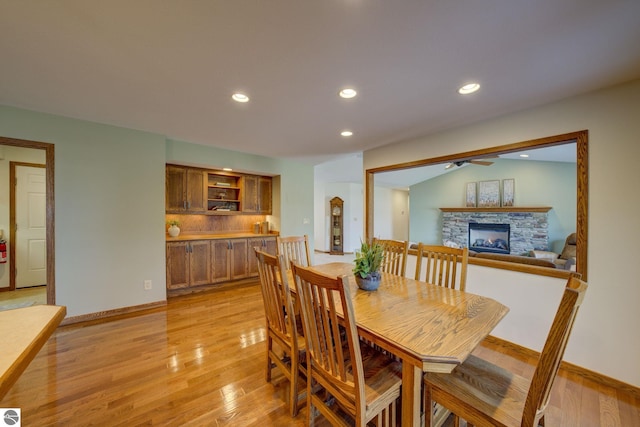 1339 Killdeer Ln, Kingsley, MI 49649 - dining space with recessed lighting, a fireplace, light wood-style floors, and ceiling fan