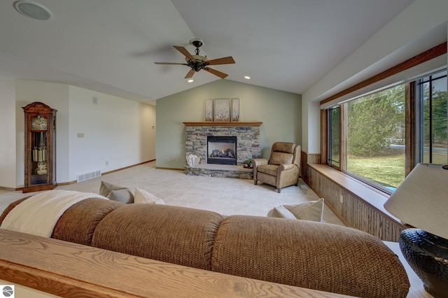 1339 Killdeer Ln, Kingsley, MI 49649 - living room with visible vents, a stone fireplace, ceiling fan, light carpet, and lofted ceiling