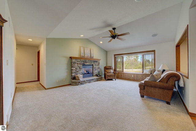 1339 Killdeer Ln, Kingsley, MI 49649 - living area with a stone fireplace, a ceiling fan, recessed lighting, light colored carpet, and lofted ceiling