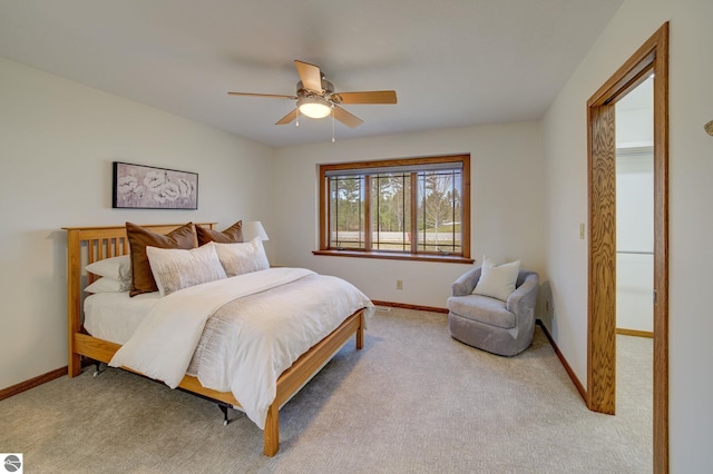 1339 Killdeer Ln, Kingsley, MI 49649 - bedroom with baseboards, a ceiling fan, and carpet