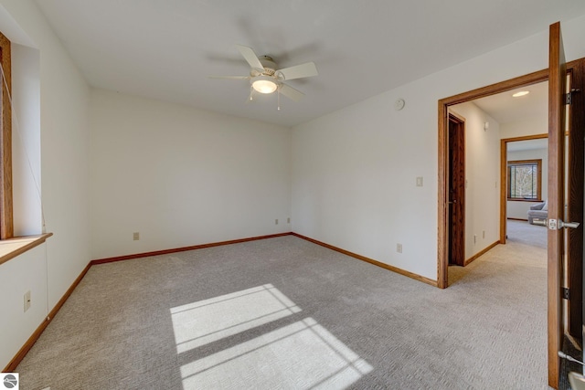 1339 Killdeer Ln, Kingsley, MI 49649 - unfurnished room featuring baseboards, a ceiling fan, and light carpet