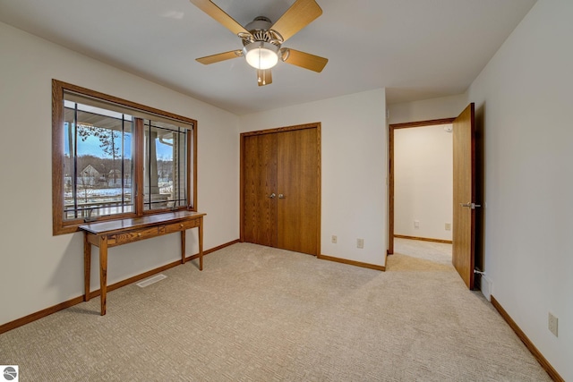 1339 Killdeer Ln, Kingsley, MI 49649 - unfurnished bedroom featuring a closet, light colored carpet, baseboards, and visible vents