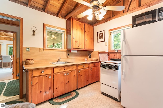 kitchen with wooden ceiling, a sink, light countertops, white appliances, and beam ceiling