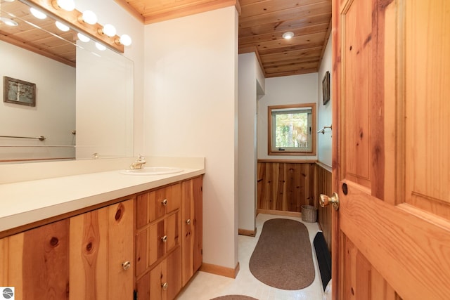 bathroom with vanity and wooden ceiling