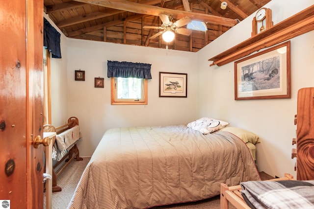 carpeted bedroom with wooden ceiling and vaulted ceiling with beams