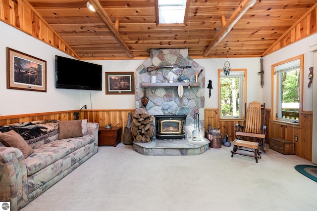 living area featuring wooden ceiling, vaulted ceiling with beams, carpet flooring, and wainscoting