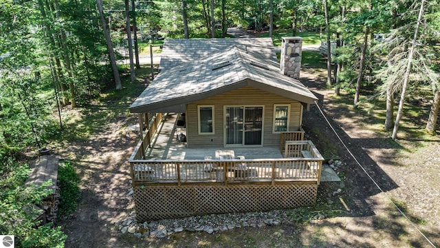 back of house with a wooden deck