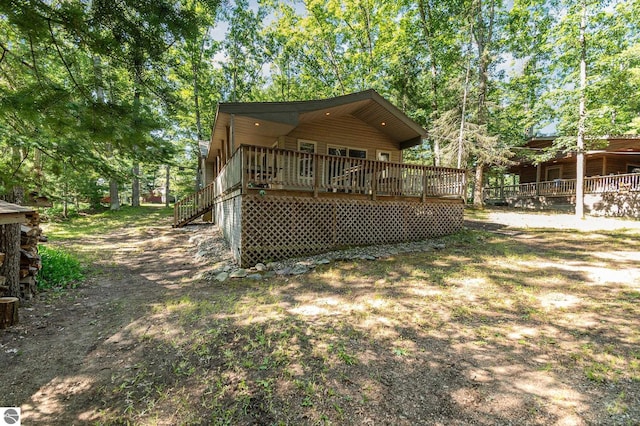 back of property with a deck
