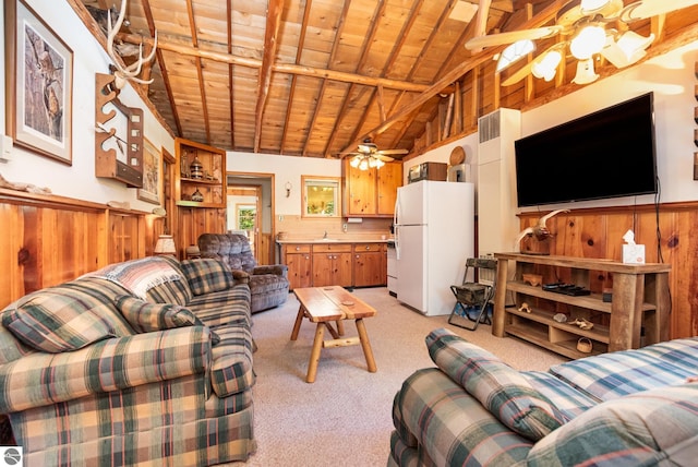 living room featuring ceiling fan, light colored carpet, wainscoting, and wood ceiling