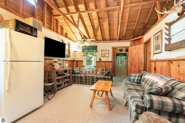 living area with wooden ceiling, carpet flooring, vaulted ceiling with beams, and a wainscoted wall