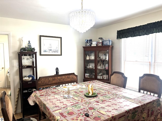 7119 Lakewood Dr, Oscoda, MI 48750 - dining room with a chandelier