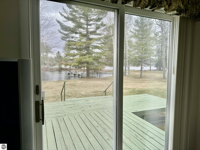 7119 Lakewood Dr, Oscoda, MI 48750 - doorway to outside featuring a water view