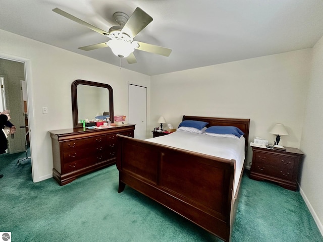 7119 Lakewood Dr, Oscoda, MI 48750 - carpeted bedroom with baseboards and a ceiling fan