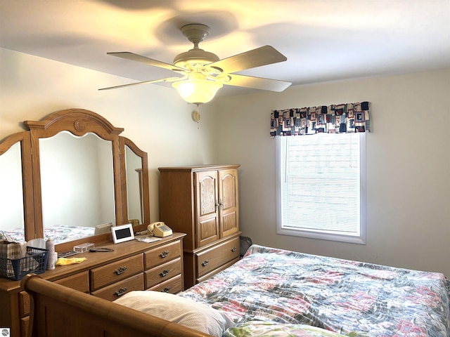 7119 Lakewood Dr, Oscoda, MI 48750 - bedroom with ceiling fan