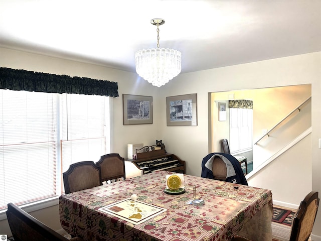 7119 Lakewood Dr, Oscoda, MI 48750 - dining space featuring an inviting chandelier