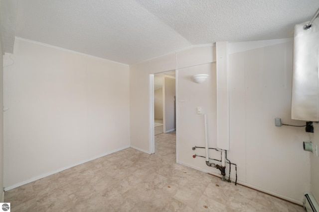 316 Grafton Ave, Alma, MI 48801 - unfurnished room with a textured ceiling and a baseboard heating unit