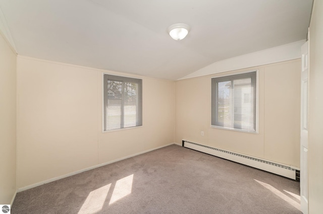 316 Grafton Ave, Alma, MI 48801 - carpeted empty room featuring baseboards, a baseboard heating unit, and vaulted ceiling
