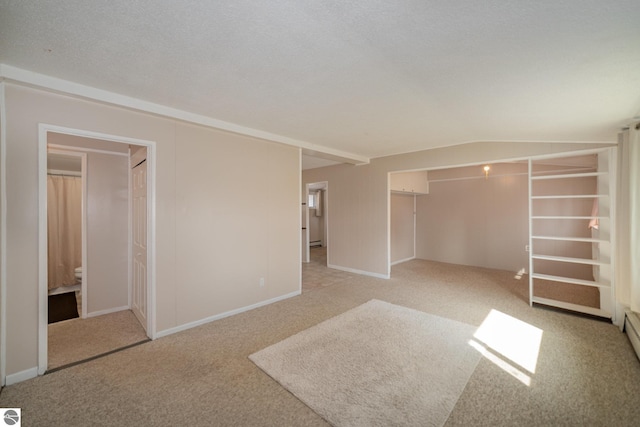 316 Grafton Ave, Alma, MI 48801 - unfurnished bedroom featuring a closet, baseboard heating, light colored carpet, and baseboards
