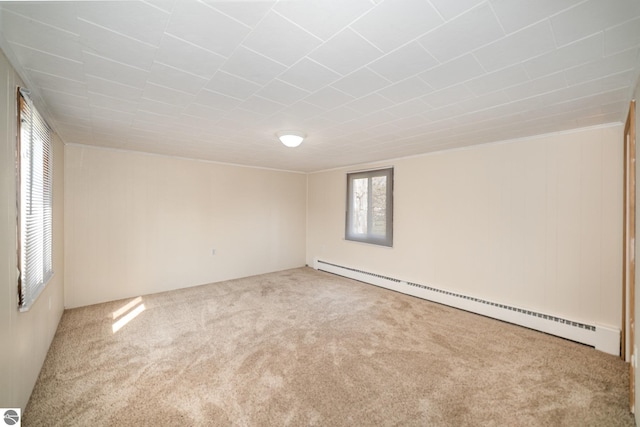 316 Grafton Ave, Alma, MI 48801 - carpeted spare room featuring a baseboard radiator