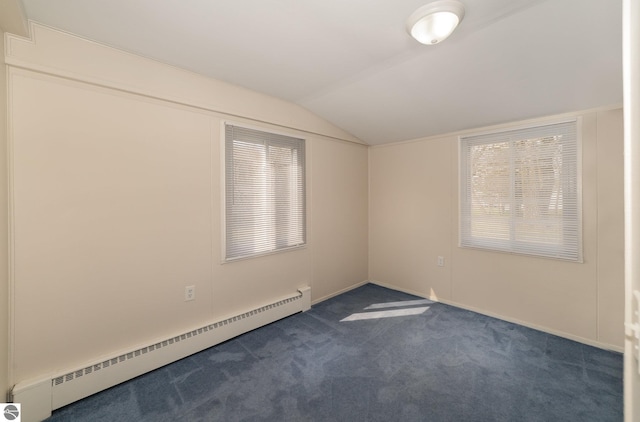 316 Grafton Ave, Alma, MI 48801 - empty room with dark carpet, a baseboard heating unit, baseboards, and vaulted ceiling