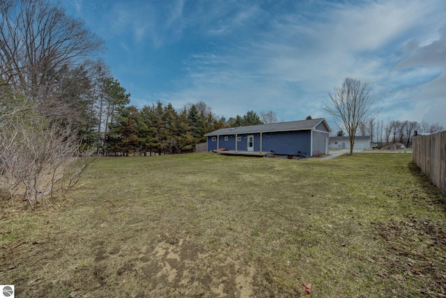view of yard with fence and a deck
