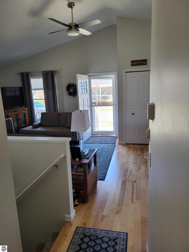 921 Cobalt St Unit 48, Traverse City, MI 49696 - living area featuring a ceiling fan, light wood-style flooring, and high vaulted ceiling