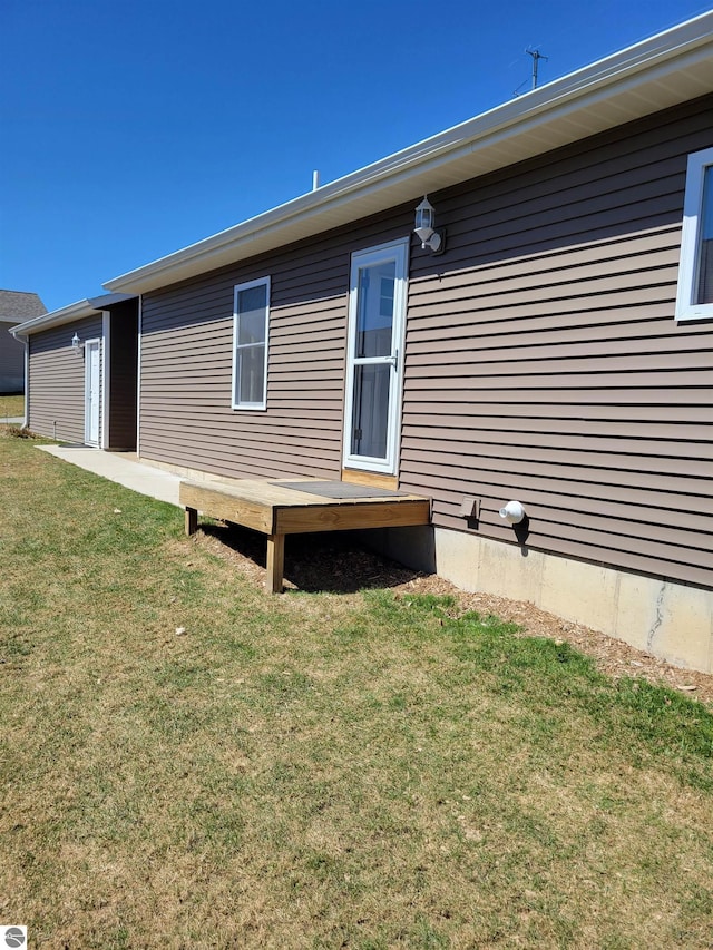 921 Cobalt St Unit 48, Traverse City, MI 49696 - rear view of property with a lawn