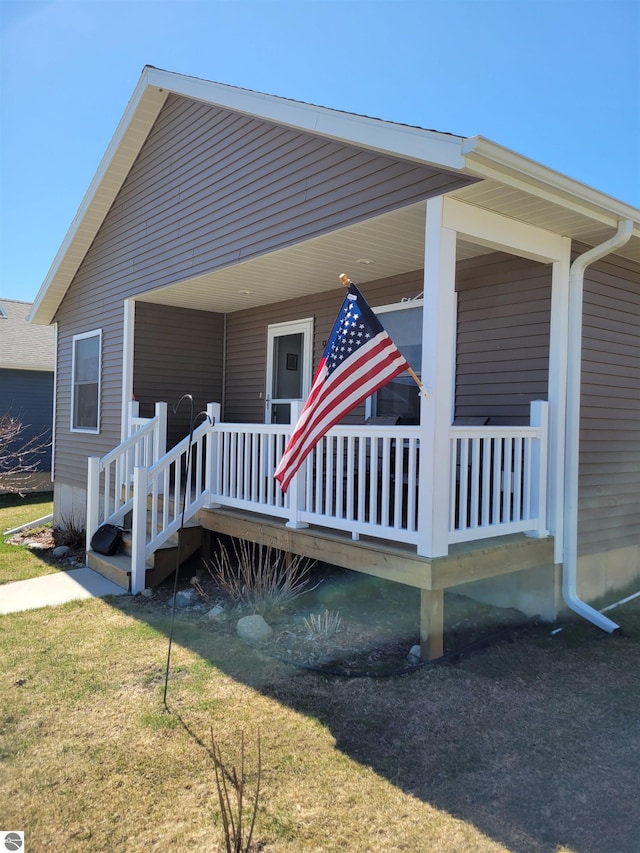 921 Cobalt St Unit 48, Traverse City, MI 49696 - view of side of home featuring a yard
