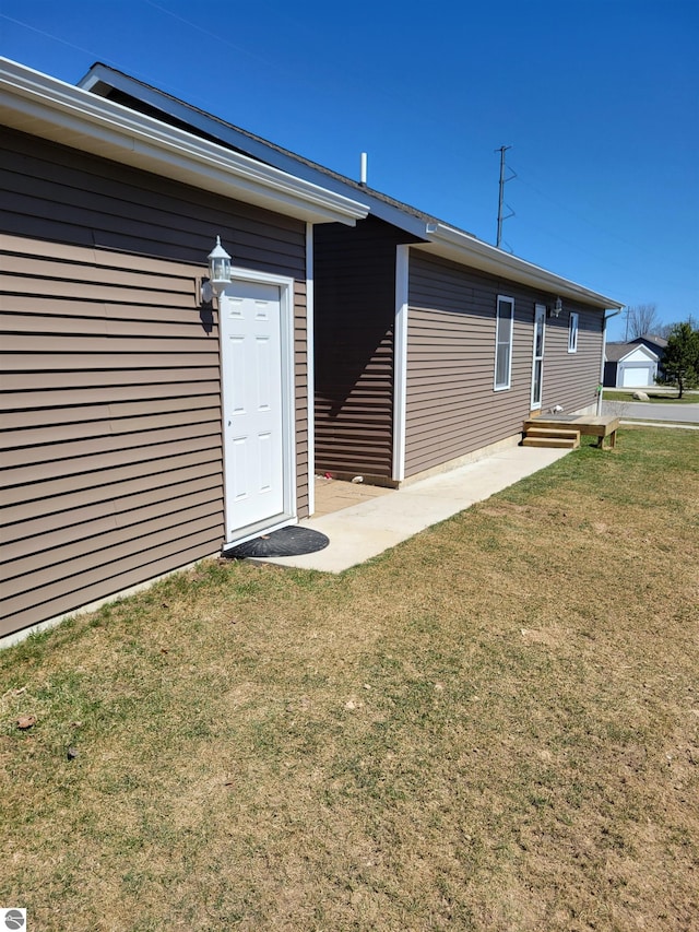 921 Cobalt St Unit 48, Traverse City, MI 49696 - back of property featuring a lawn