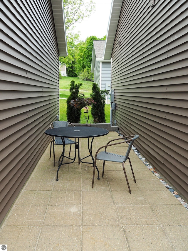 921 Cobalt St Unit 48, Traverse City, MI 49696 - view of patio / terrace with outdoor dining space