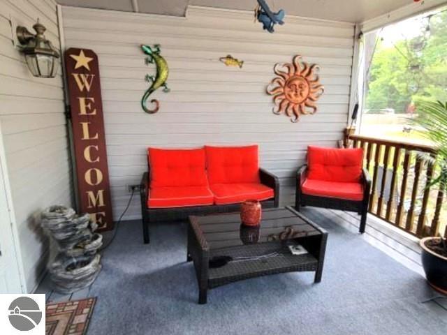 13876 Merrill Ave, Kalkaska, MI 49646 - view of patio with a porch