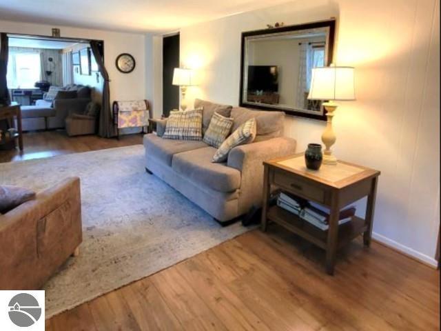 13876 Merrill Ave, Kalkaska, MI 49646 - living area with wood finished floors