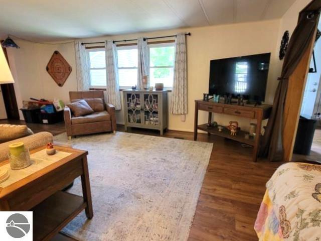 13876 Merrill Ave, Kalkaska, MI 49646 - living room featuring wood finished floors