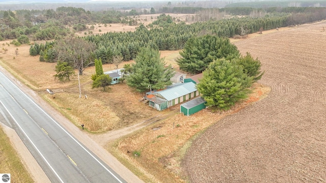 birds eye view of property with a rural view