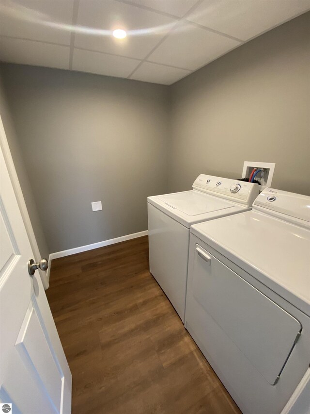 7228B S M-88, Bellaire, MI 49615 - washroom featuring baseboards, washer and clothes dryer, laundry area, and dark wood finished floors