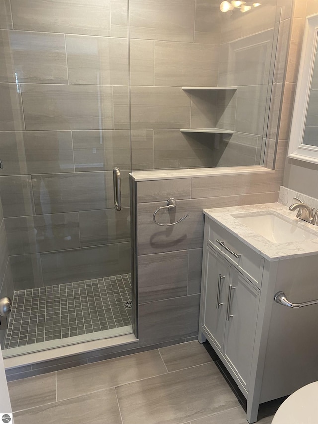 7228B S M-88, Bellaire, MI 49615 - full bath with vanity, tile patterned flooring, and a stall shower