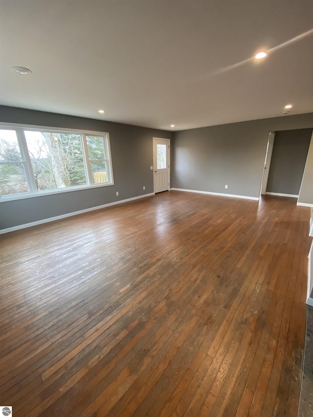 7228B S M-88, Bellaire, MI 49615 - empty room featuring dark wood finished floors, baseboards, and recessed lighting