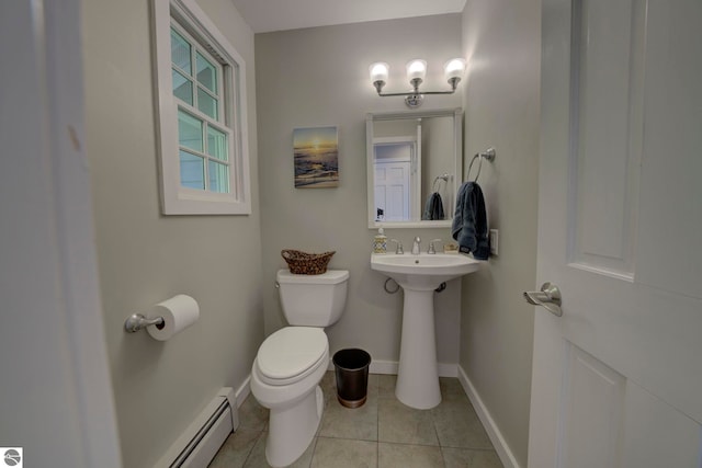 bathroom with baseboards, tile patterned flooring, a baseboard radiator, and toilet