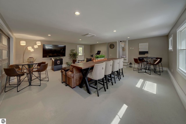 dining room featuring recessed lighting and baseboards