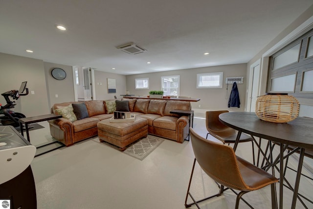 living room featuring visible vents and recessed lighting